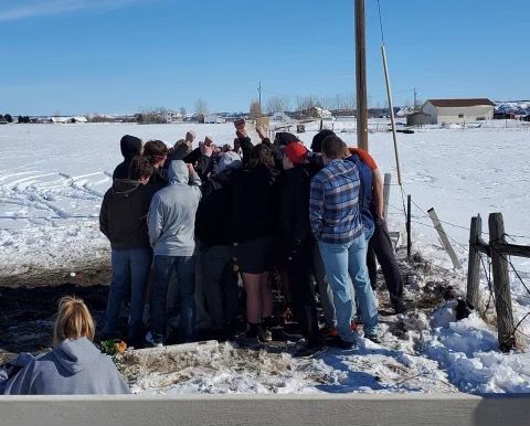 Crash memorial huddle